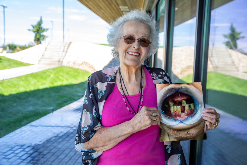 patient smiling with their before photo
